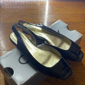 Black patent leather sling back shoes